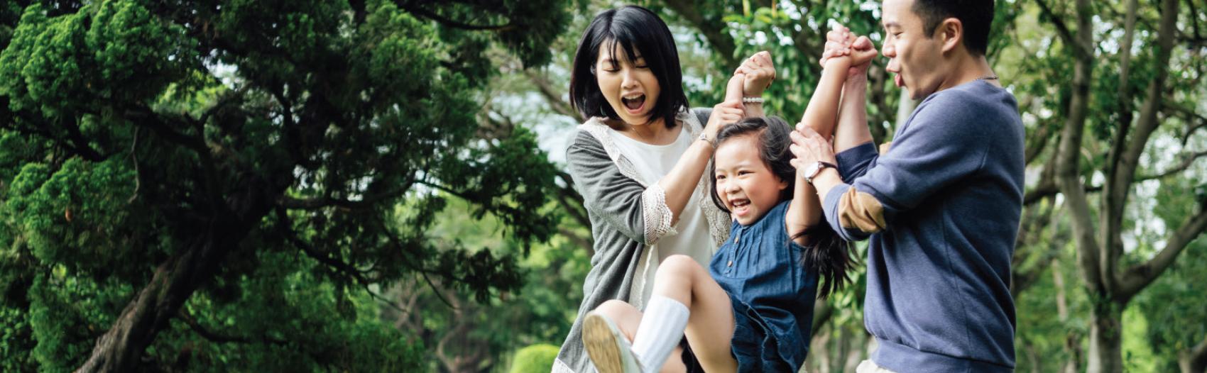 family playing in a park