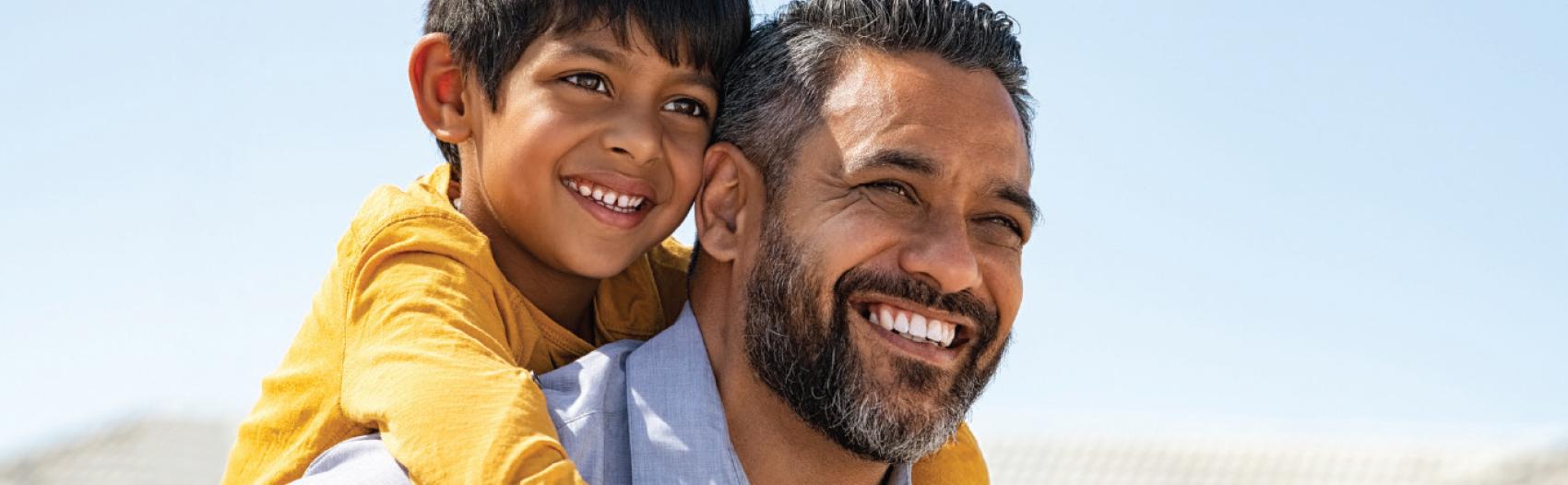 father and son looking forward to the future smiling