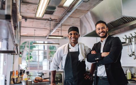 chef and business owner smiling